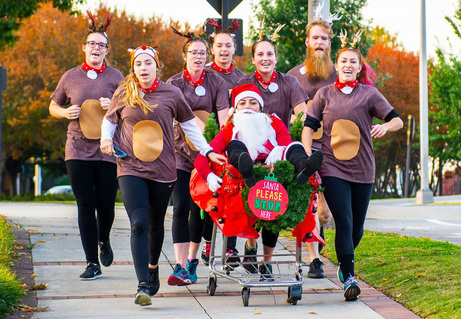 Participants of the 2018 Halloween Holla dressed as reindeers and Santa.
