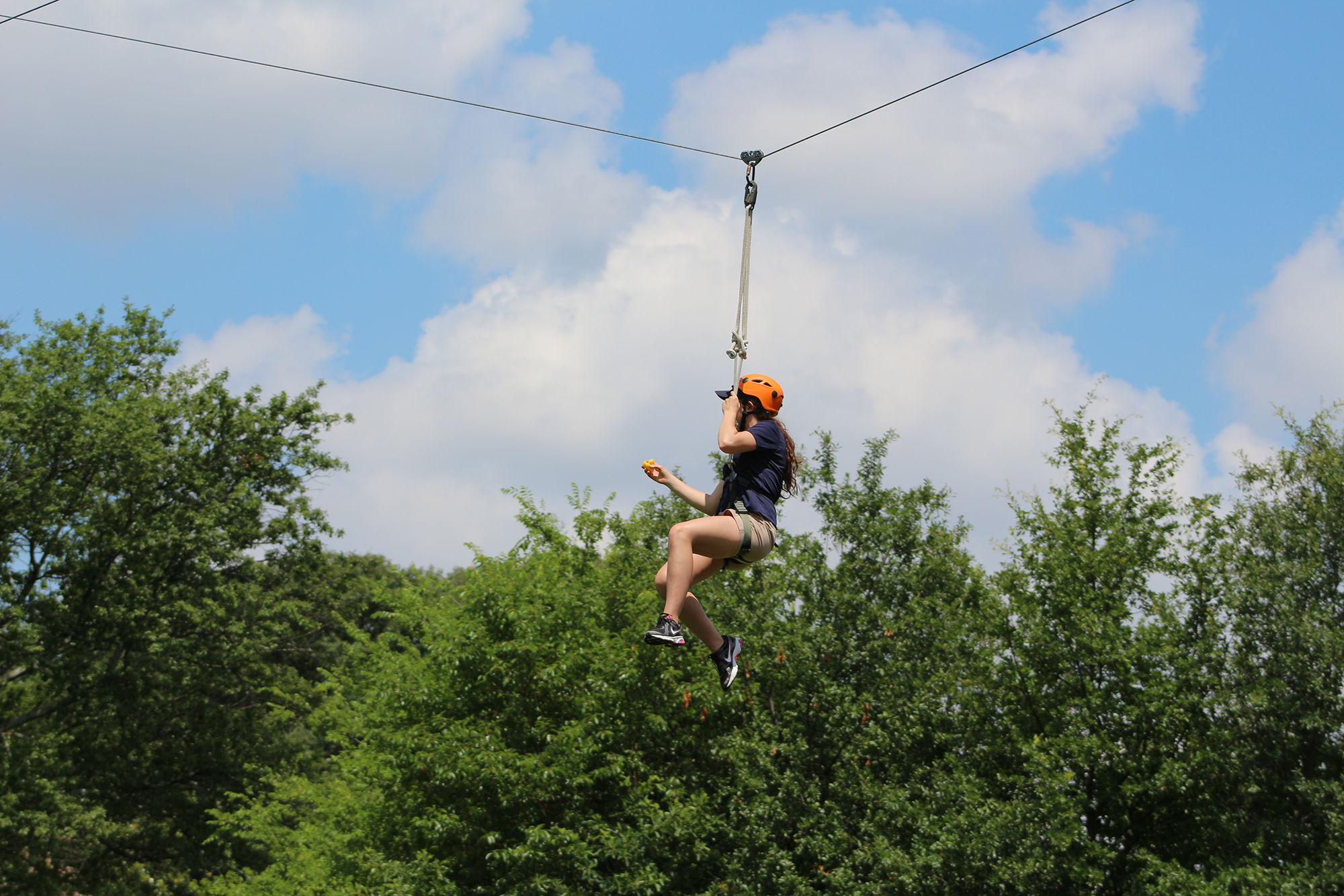 Student ziplining at the CRC's Leadership Challenge Course.